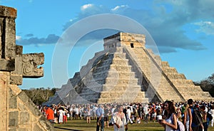 CHICHEN ITZA, MEXICO - MARCH 21,2014: Tourists watching the feathered serpent crawling down the temple Equinox March 21 2014