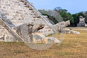 Chichen Itza, Mexico, serpent sculpture at the base of the stairways of El Castillo.