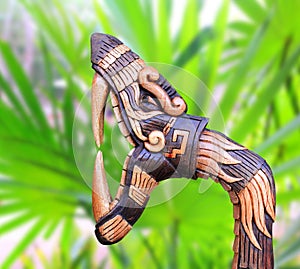 Chichen Itza Snake symbol wood handcraft Mexico photo