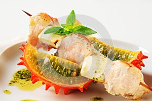 Chicken and aubergine skewer with pesto and horned melon