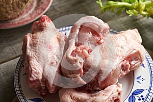 Chicken backs on a plate - ingredient for bone broth
