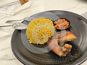 Chicken Biryani using Basmati rice and sambal on marble background
