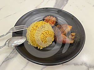 Chicken Biryani using Basmati rice and sambal on marble background