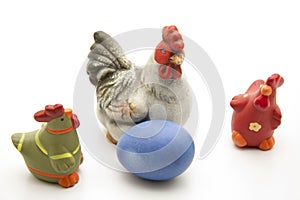 Chicken with blue Easters egg