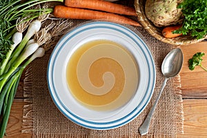 Chicken bone broth with vegetables, top view