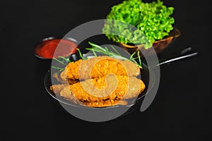 Chicken Breaded Raw Meat.Semifinished Breaded chicken nuggets from chicken fillet on a dark background with fresh herbs