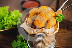 Chicken Breaded Raw Meat.Semifinished Breaded chicken nuggets from chicken fillet on a dark background with fresh herbs