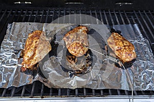 Chicken Breast Barbecuing On The Grill