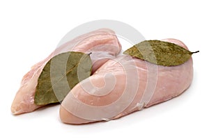 Chicken breast with bay leaf on a white