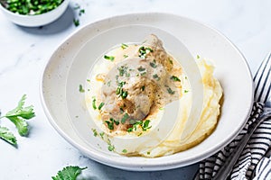 Chicken breast in creamy sauce with mashed potatoes