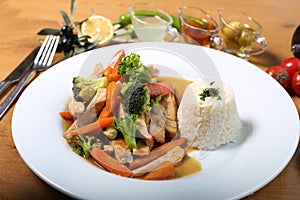 Chicken breast cuts with rice and vegetables