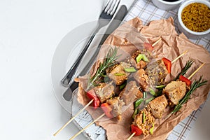 Chicken breast skewers with bell pepper. The meat is marinated in soy sauce with honey and mustard. Decorated with sprigs of