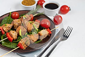 Chicken breast skewers with bell pepper. The meat is marinated in soy sauce with honey and mustard. Decorated with sprigs of