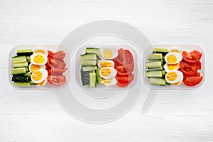 Chicken breast and vegetables in containers. Flat lay