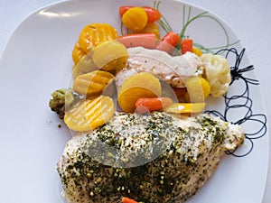 Chicken breast with vegetables on a plate, dinner service, vegetarian food, healthy food. baked chicken breast with brussels