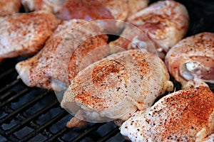 Chicken breasts cooking on a grill
