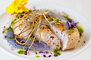 Chicken breasts elegantly served on white plate