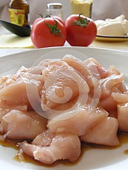 Chicken breasts and rabbit meat photo