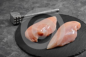 Chicken breasts, raw chicken fillet Photo for a store with natural products. Food delivery, gray background. copies of