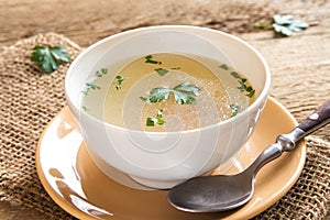 Chicken broth with parsley photo