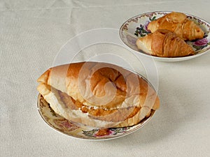 Chicken burger and croissant