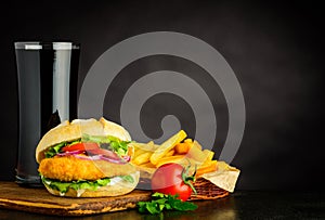 Chicken burger with French Fries and Cola on Copy Space