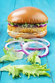 Chicken burger with onions
