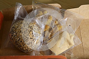 Chicken burger set meal in plastic packaging