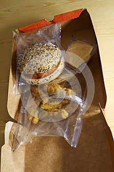 Chicken burger set meal in plastic packaging