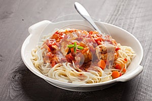 Chicken Cacciatore over pasta horizontal shot photo