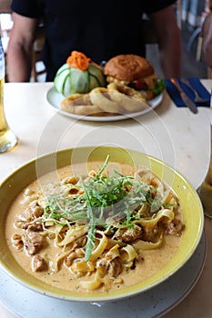 Chicken with cashew nuts and tagliatelle