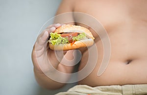 Chicken cheese Hamburger on obese fat boy hand