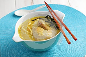 Chicken coconut milk soup with pasta, nori, and curry