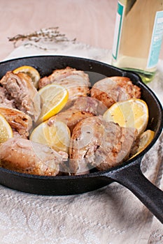 Chicken cooked with lemon and whiet wine