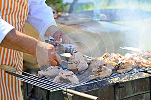 Chicken cooking on barbecue grill