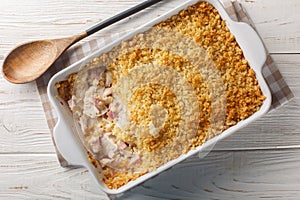 Chicken Cordon Bleu Casserole with chicken breast, chopped ham and Swiss cheese layered with creamy sauce and breadcrumbs close up