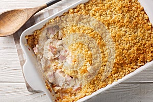 Chicken Cordon Bleu casserole layered together, it\'s a warm and comforting weeknight meal close up. Horizontal