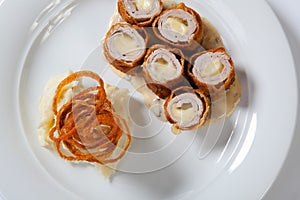 Chicken Cordon bleu on a plate with rustic mashed potatoes.