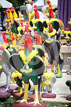 Chicken crowd statue for fullfill one's obligations