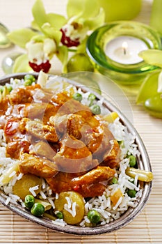 Chicken curry with basmati rice and green peas