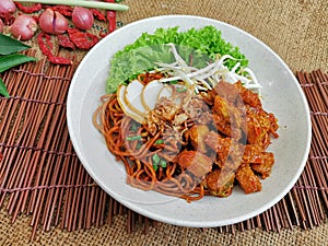 Chicken Curry Dry Noodle served dish isolated on table top view of thai food