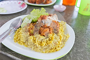 Chicken curry with rice on a table, select focus