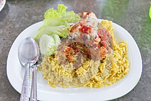 Chicken curry with rice on a table, select focus