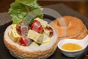 Chicken curry salad in bread bowl