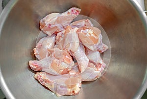 Chicken Drum Sticks in a Metallic Mixing Bowl