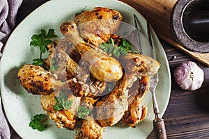 Chicken drumsticks on plate above