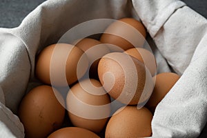 Chicken egg in bag on the concrete table background