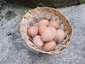 Chicken eggs in a bamboo basket