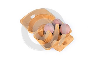 Chicken eggs in box on white background