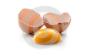 Chicken eggs and broken egg with yolk isolated on white background